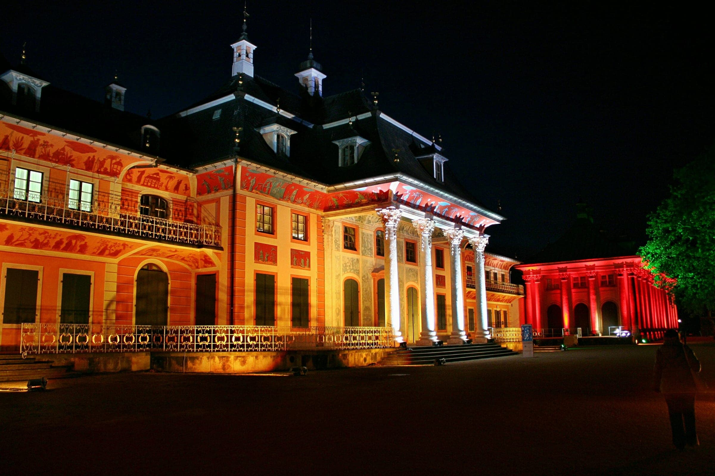 Warm floodlight washes the Bergpalais of Schloss Pillnitz during the Christmas Garden in Dresden.