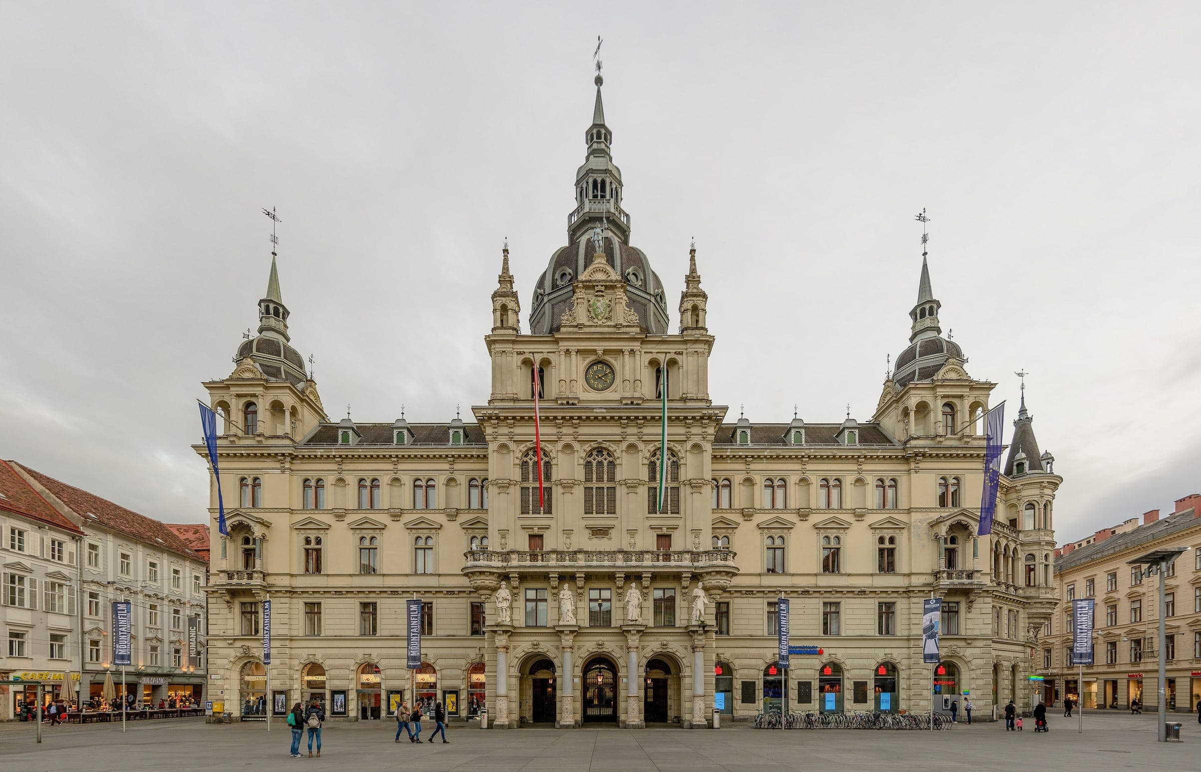 The domed neo-Renaissance Rathaus of Graz faces the open Hauptplatz on an overcast November day.