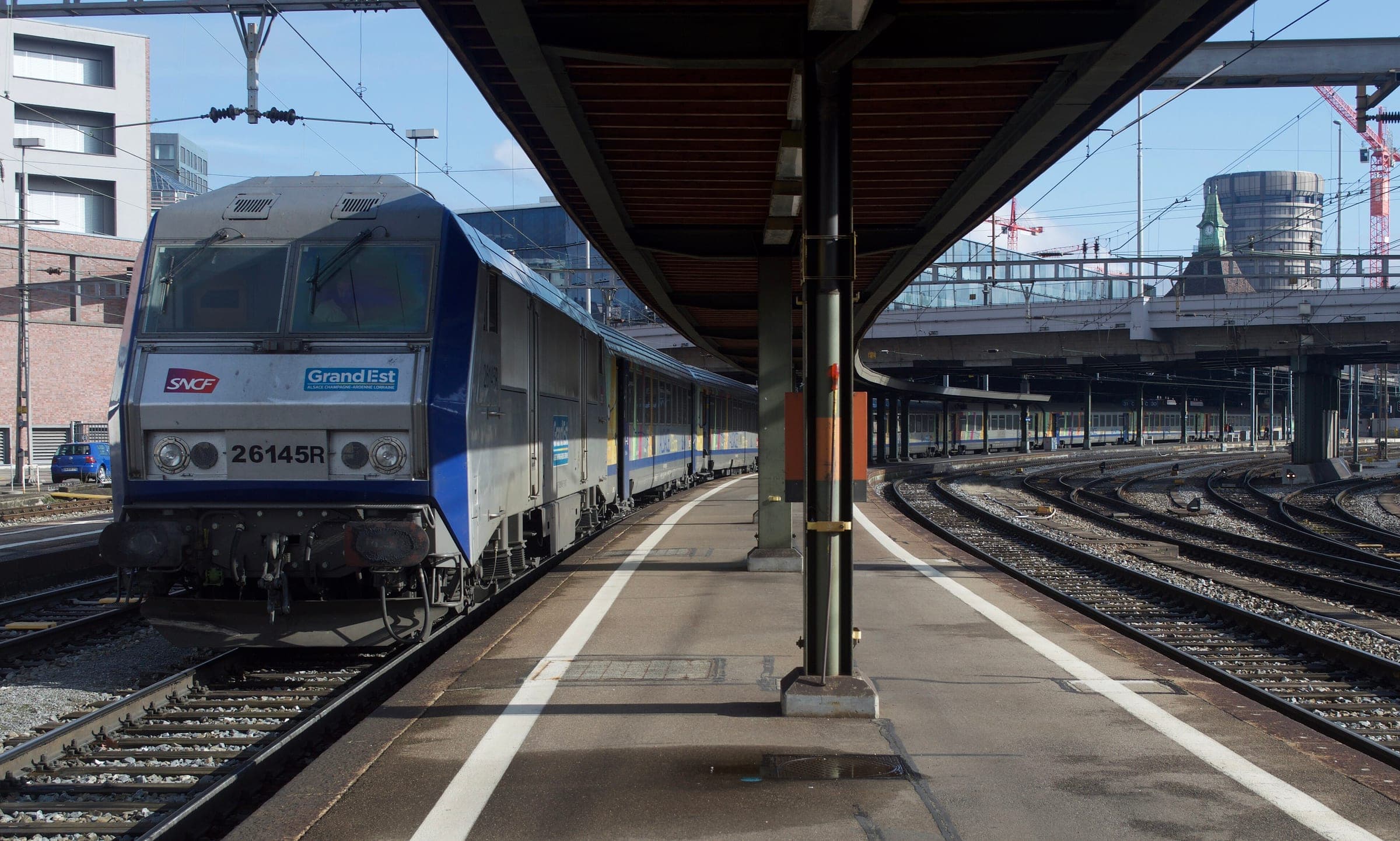 A Grand Est TER train waits at the French platforms of Basel SBB station.