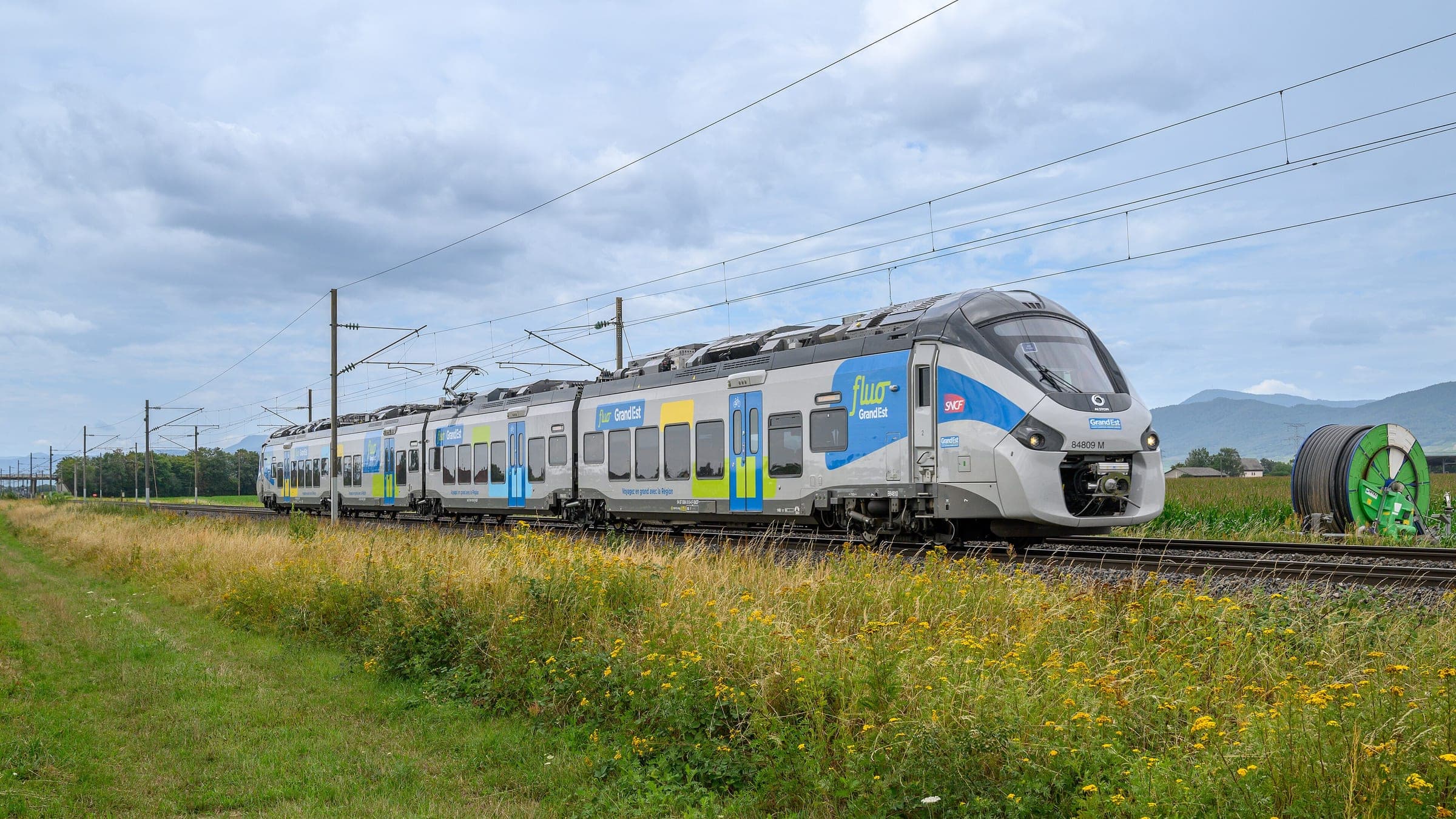 A Fluo Grand Est regional train crosses the Alsace plain at Ebersheim near Sélestat on its way to Strasbourg.