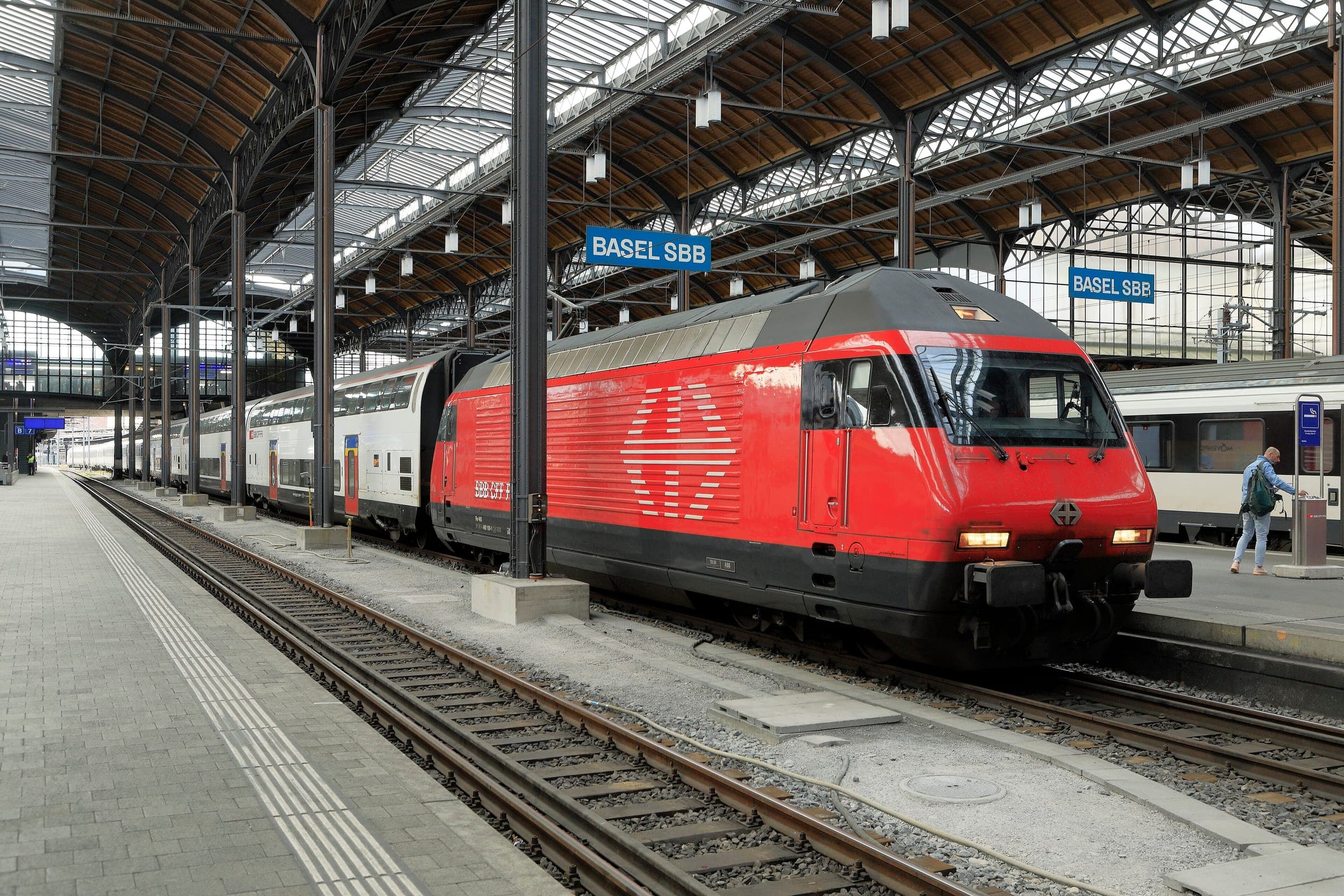An SBB InterRegio for Zürich waits under the iron train shed of Basel SBB station.