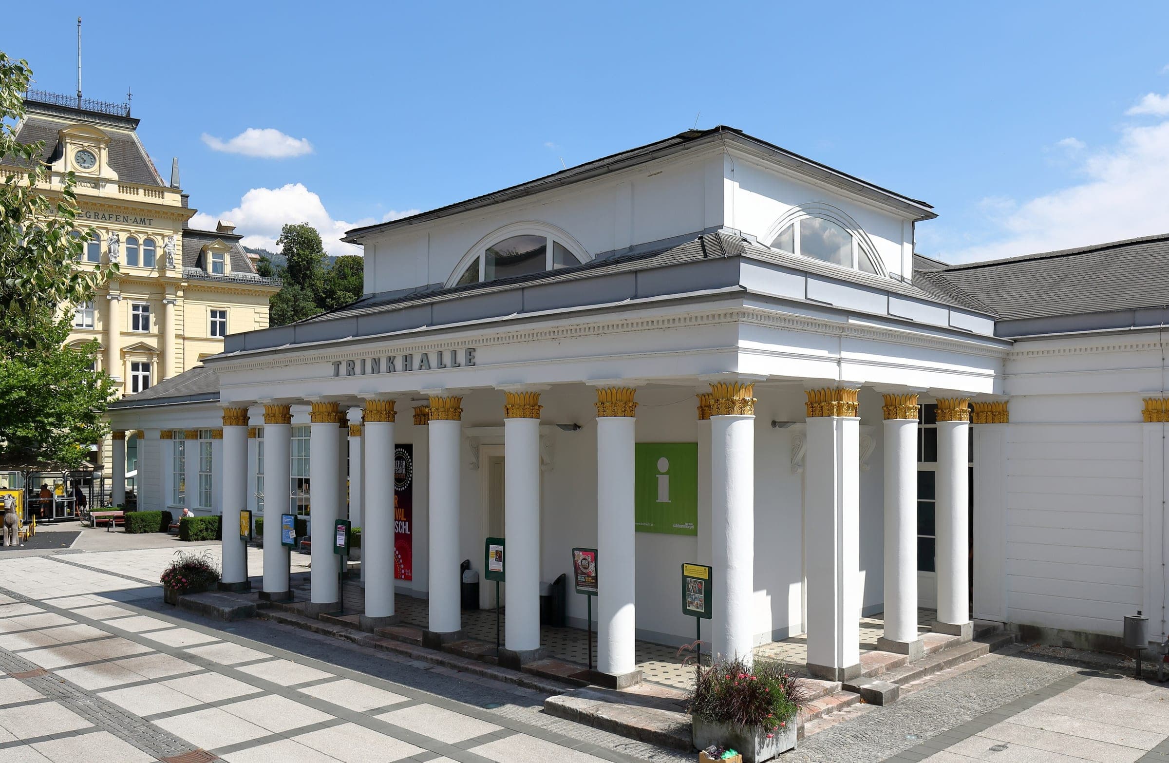 Gilded capitals top the white columns of the Trinkhalle on Bad Ischl's Auböckplatz