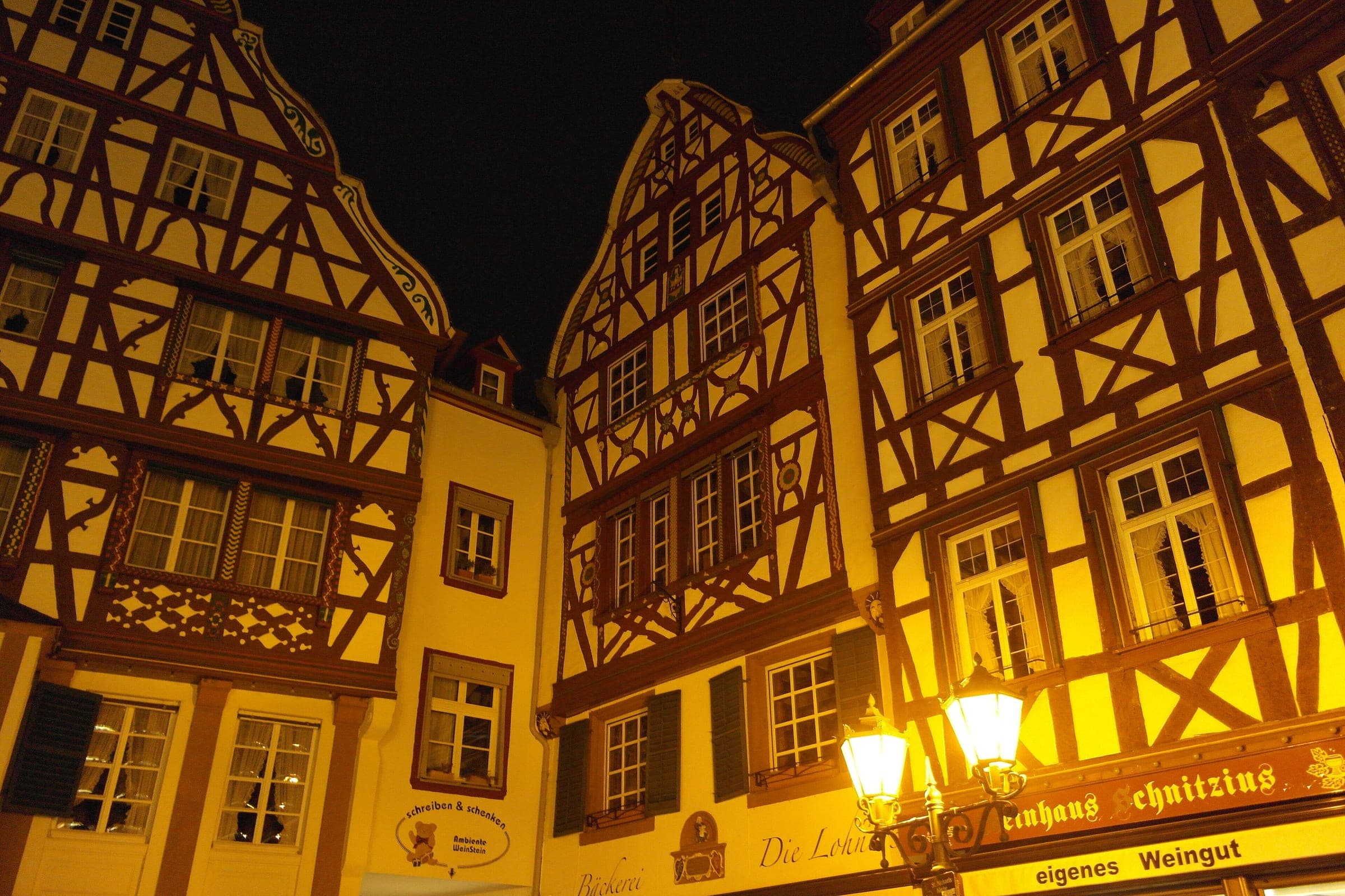 Street lamps light the half-timbered gables around the Marktplatz in Bernkastel at night
