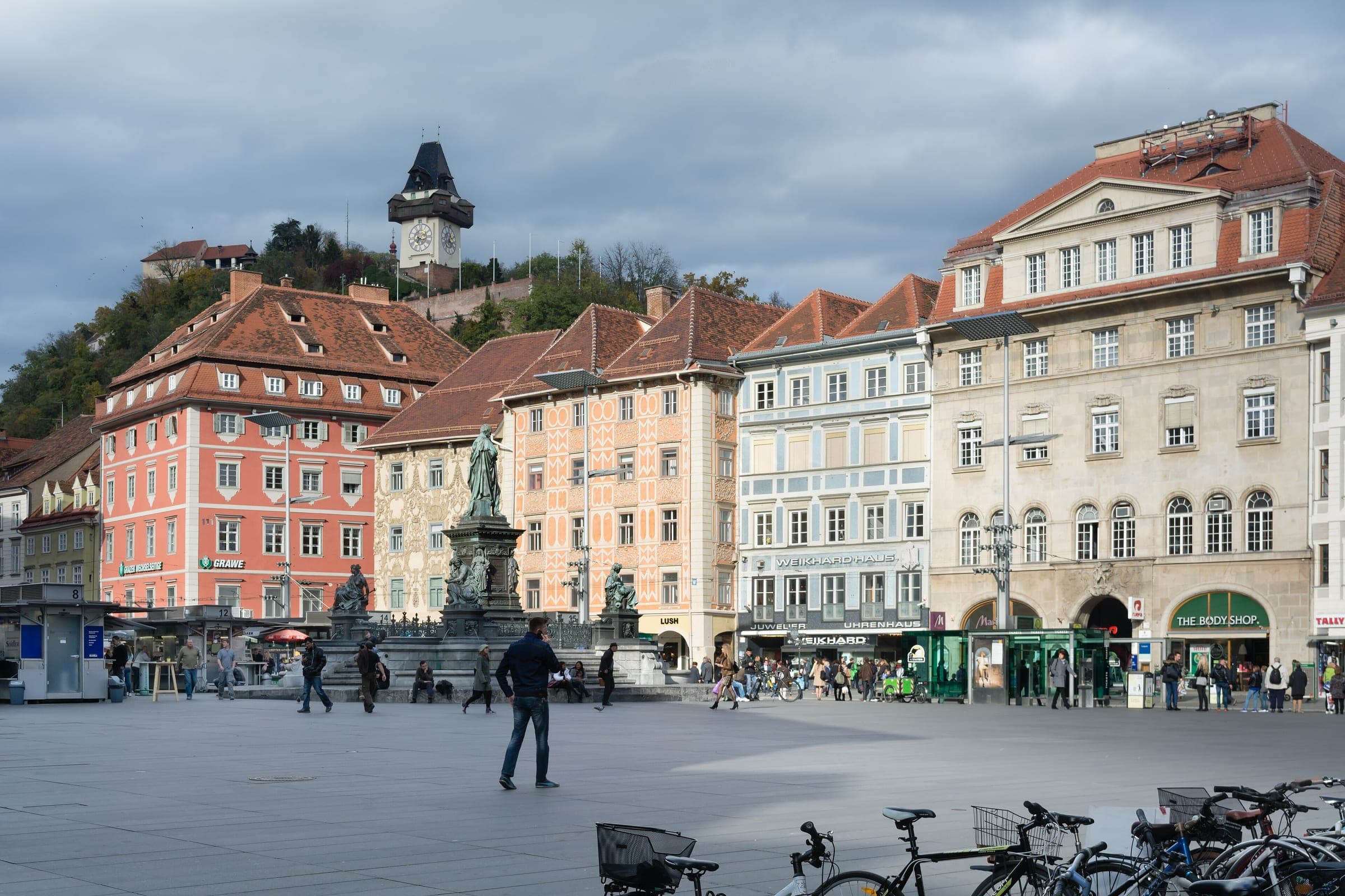 The Archduke Johann fountain stands on Hauptplatz in Graz below the Uhrturm on the Schlossberg.