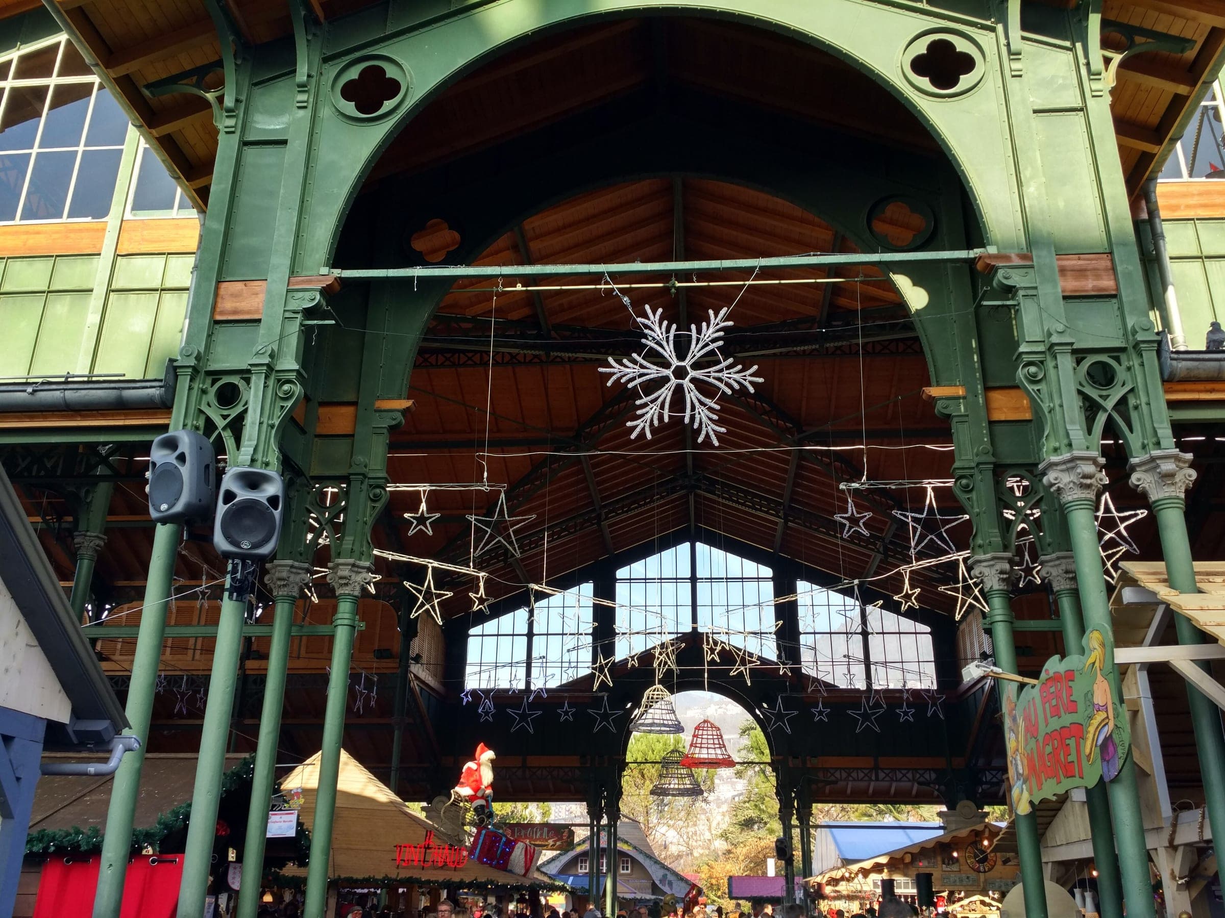 Snowflakes and stars hang under the iron arch of the Montreux market hall during the Christmas market