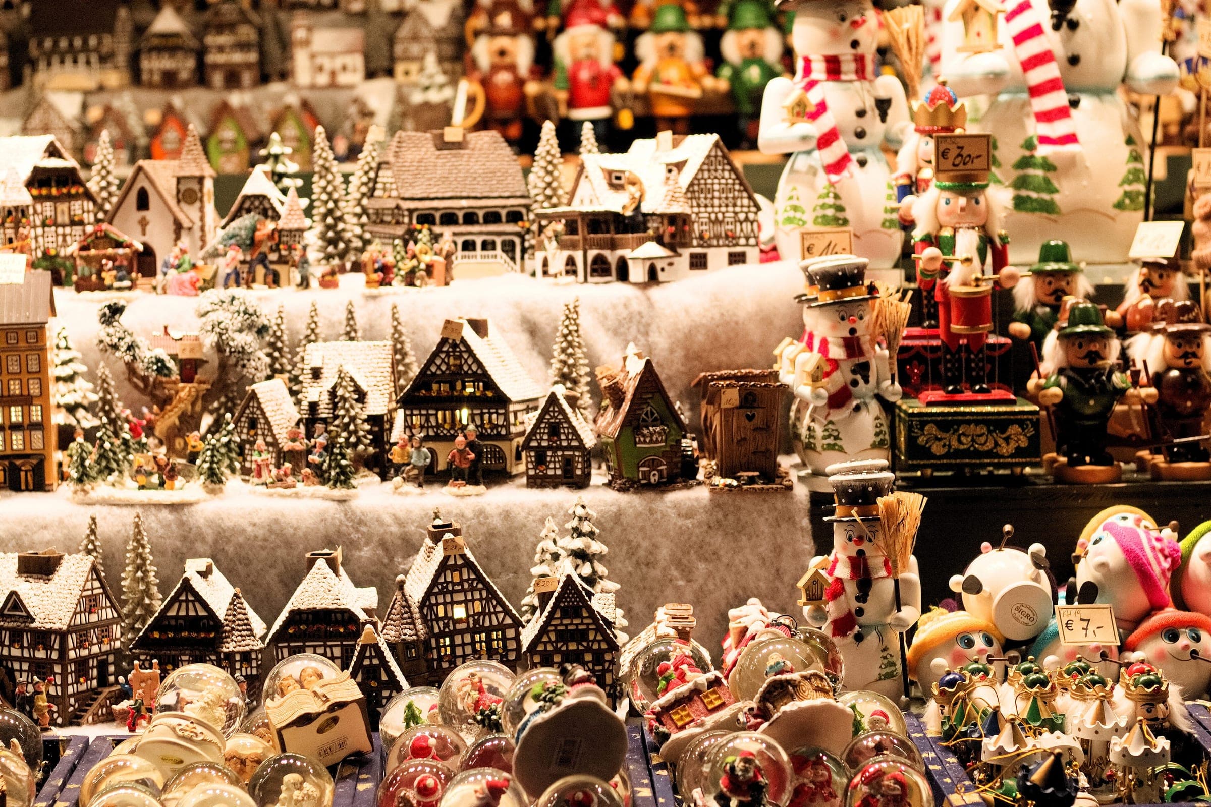 Ceramic houses, nutcrackers and snowmen crowd a stall at the Salzburg Christkindlmarkt
