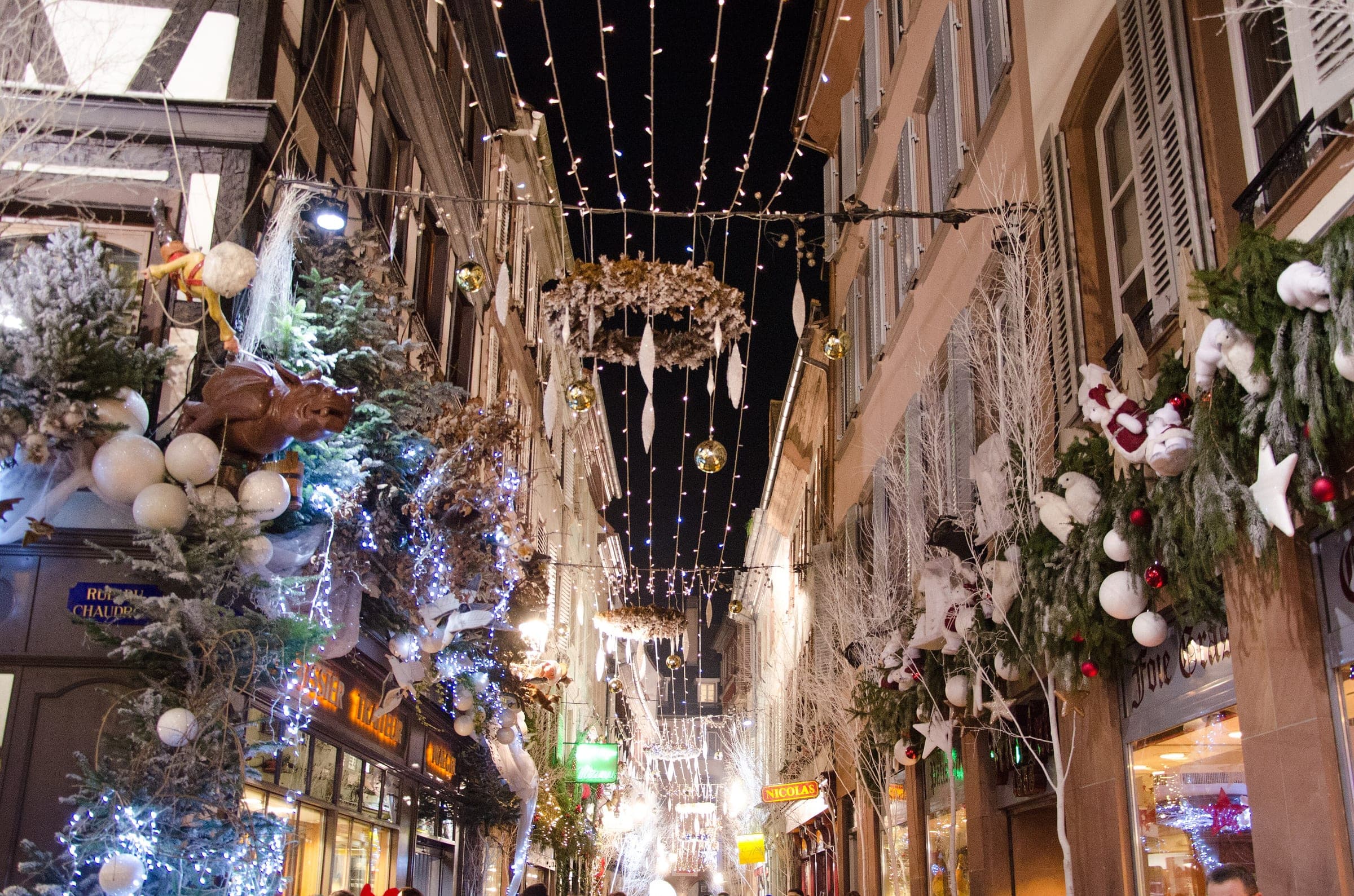 Lit canopies and frosted garlands fill a shopping street in Strasbourg's Carré d'Or during Advent.