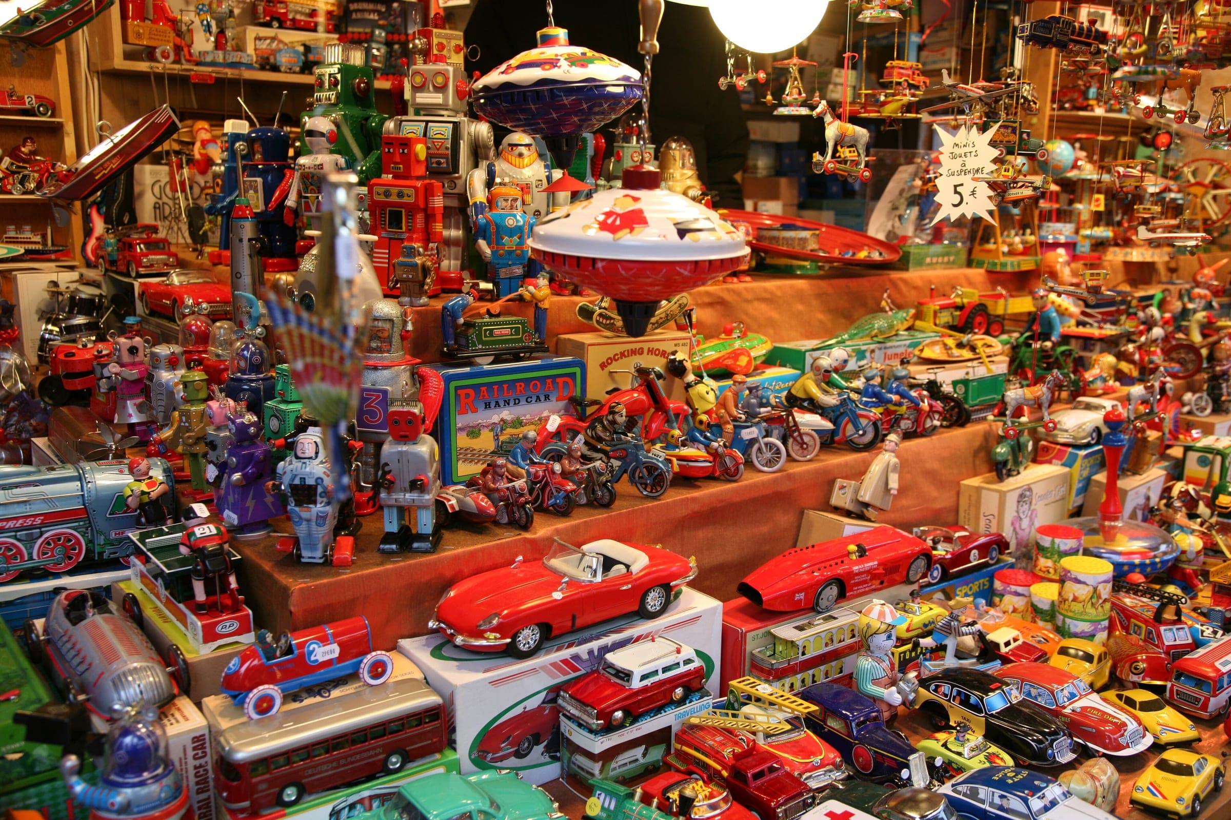 Tin robots, toy cars and spinning tops crowd a toy stall at the Christkindelsmärik in Strasbourg.
