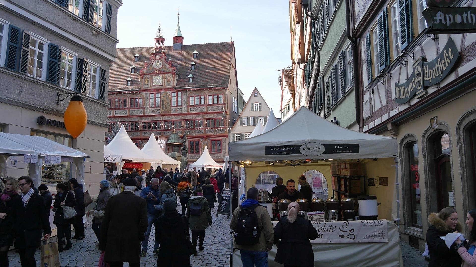 White chocolART tents line the lane toward the painted Rathaus on Tübingen's Marktplatz.