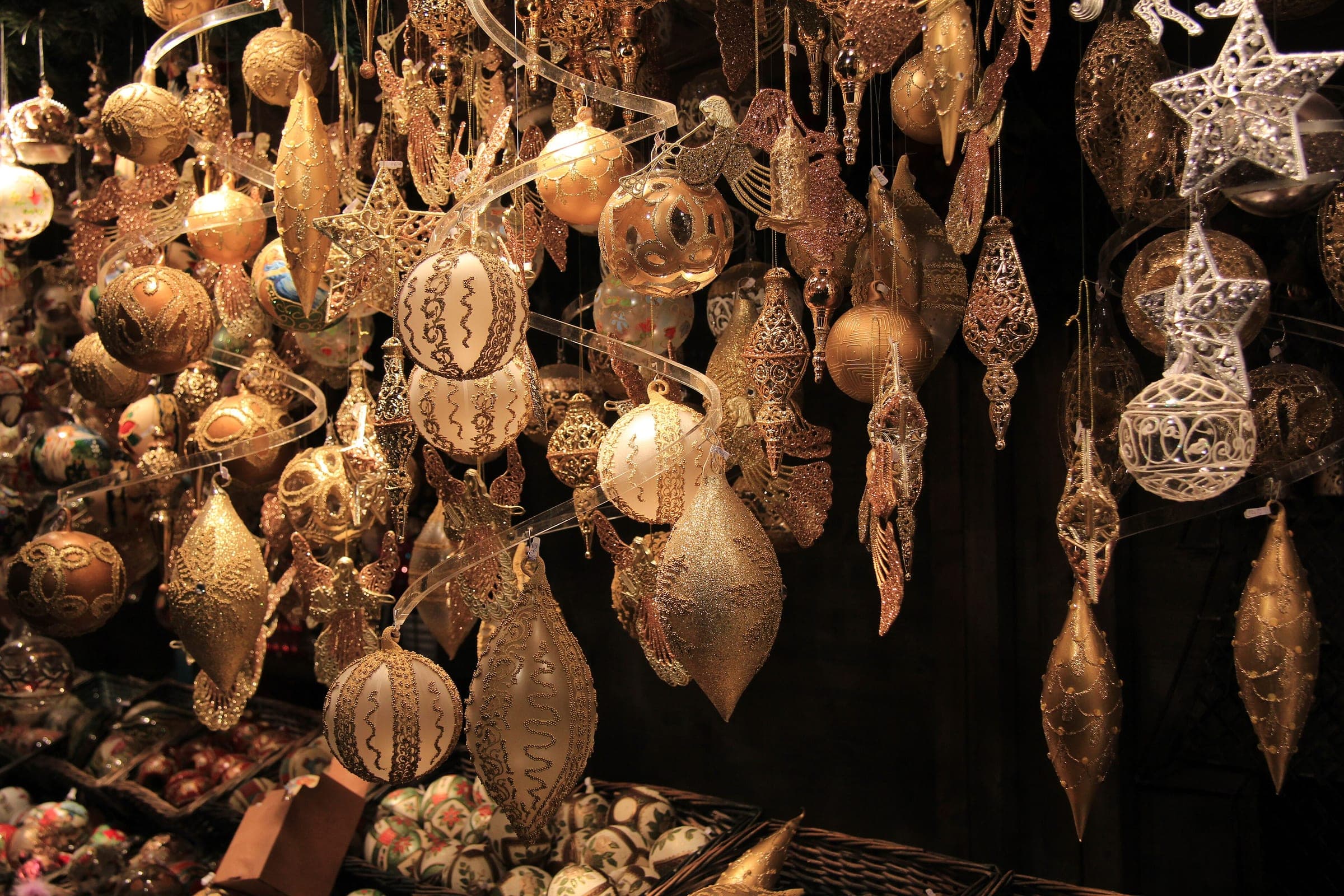 Gold baubles and stars hang in a stall at the Belvedere Christmas village in Vienna.