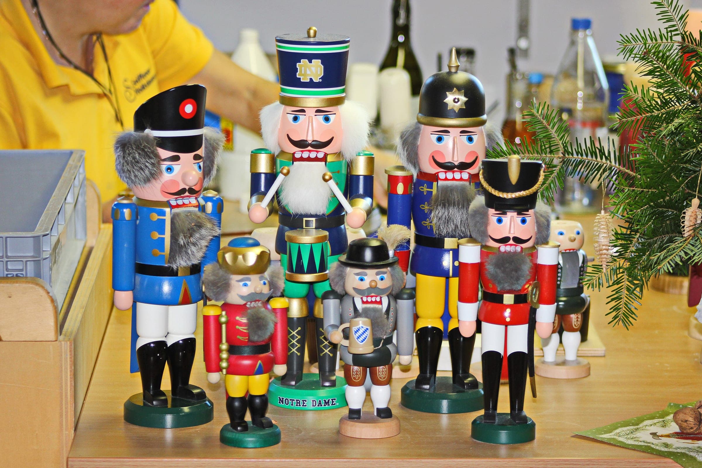 Painted nutcrackers stand finished on a workbench in the Seiffener Volkskunst show workshop in Seiffen.