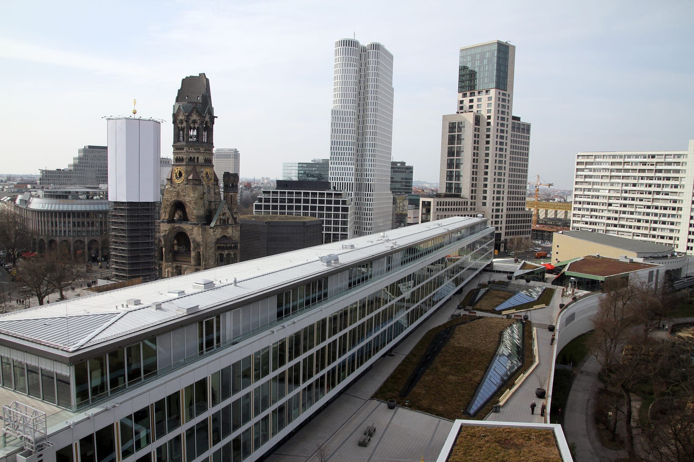 The Kaiser Wilhelm Memorial Church stands beyond the Bikini Berlin roof in the view from the Monkey Bar.