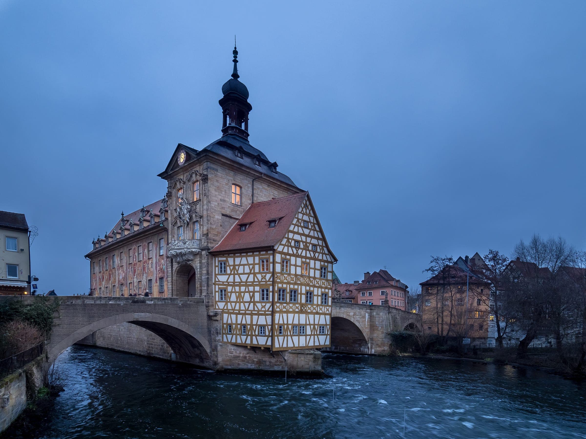 Bamberg's Altes Rathaus sits on its bridge over the Regnitz at blue hour in December