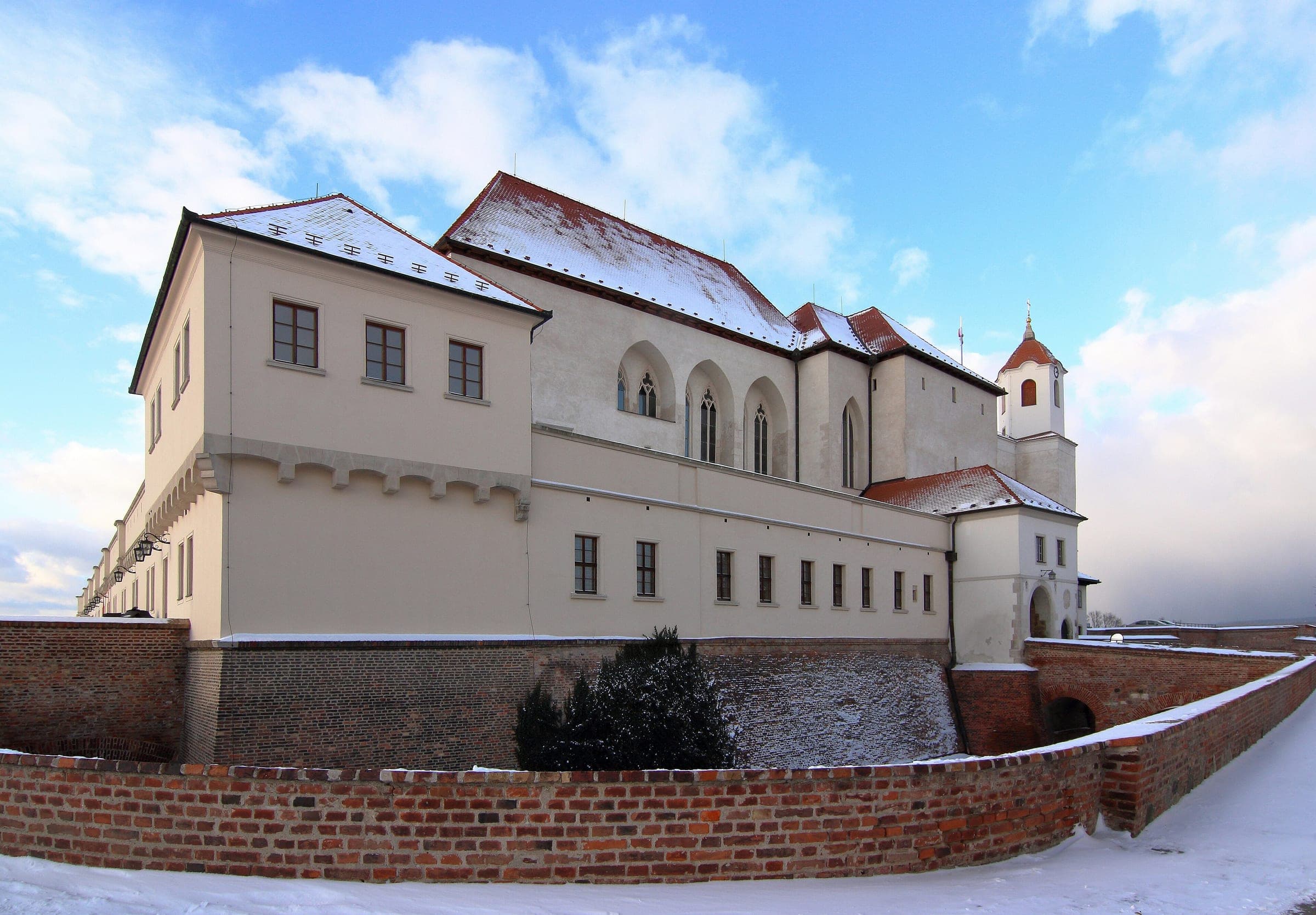 Snow lies on the roofs and ramparts of Špilberk Castle on its hill above Brno in January.