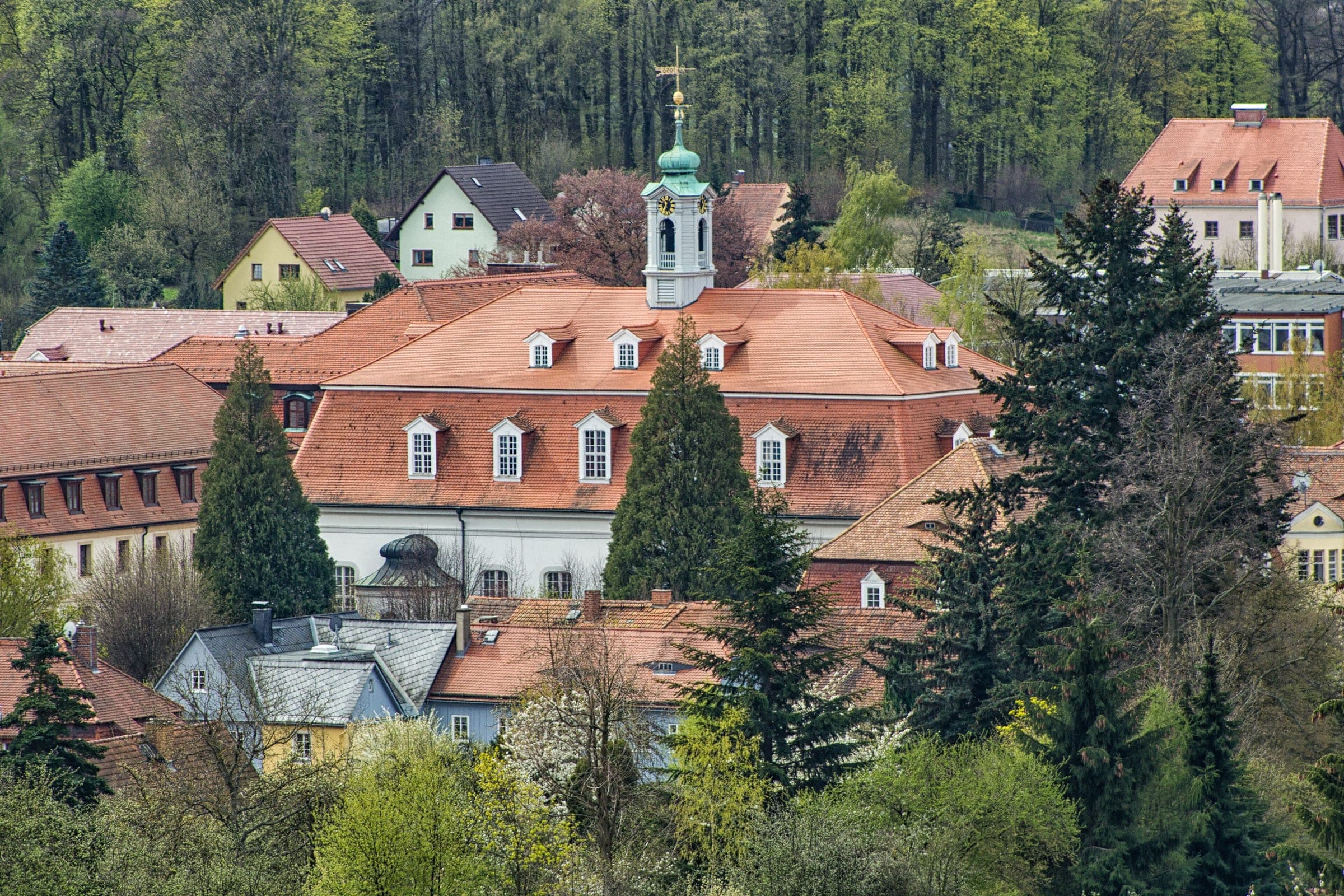 The Kirchensaal tower rises over the red roofs of Herrnhut in this view from the Hutberg.