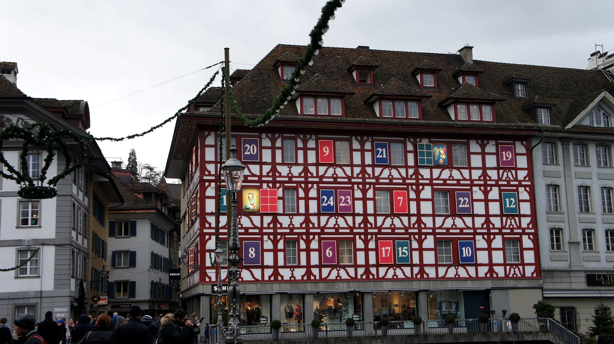The windows of a half-timbered house in Lucerne's old town become a numbered Advent calendar