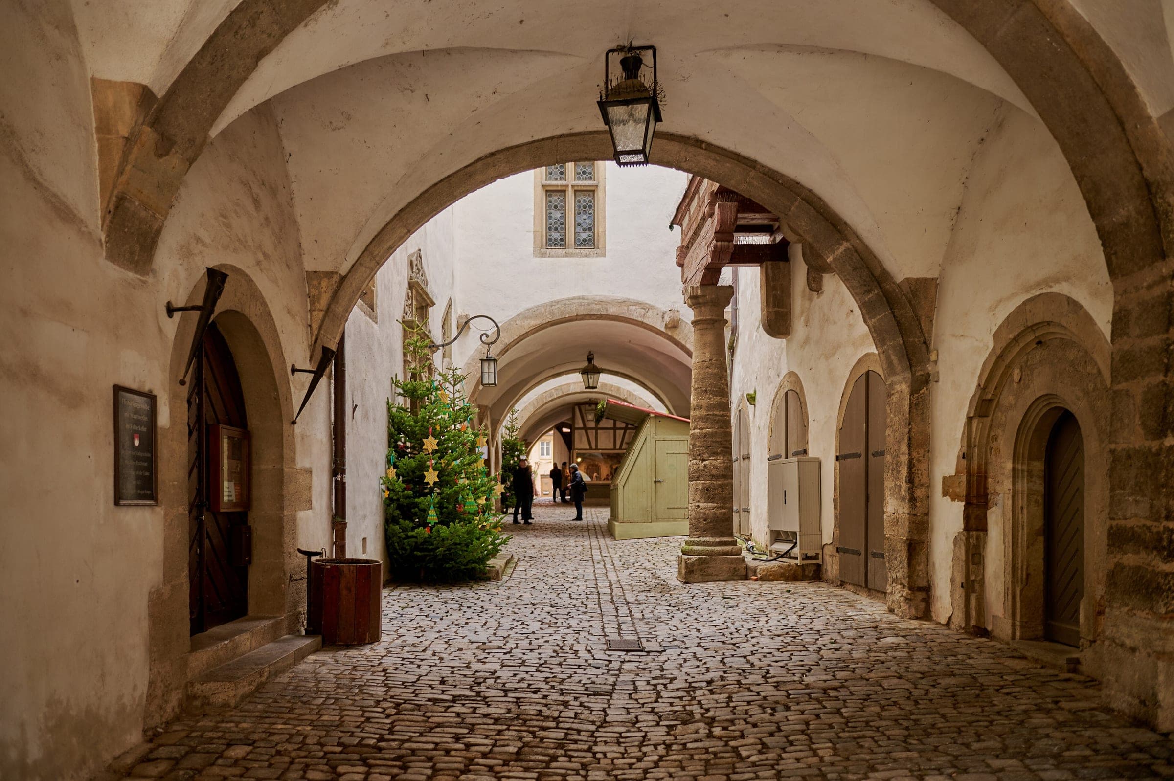 A Christmas tree stands in the arched passage under the Rathaus in Rothenburg ob der Tauber