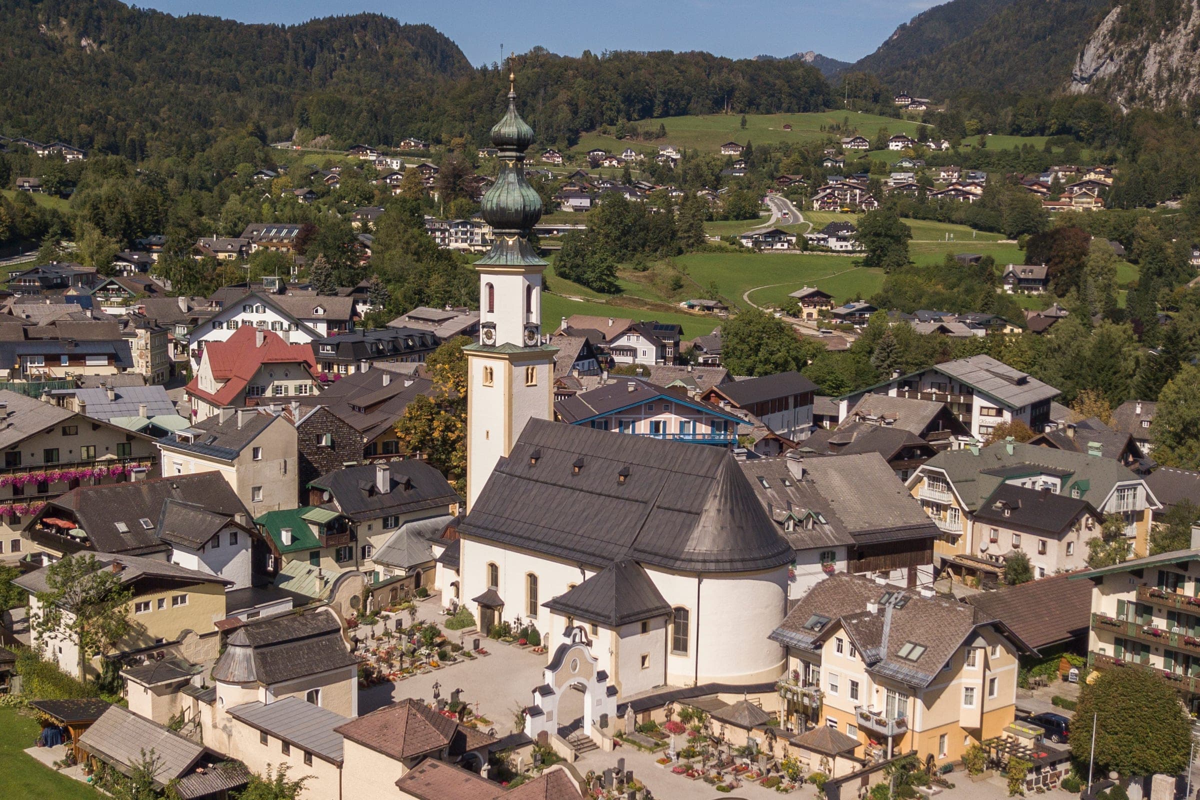 The onion dome of St Gilgen's parish church rises above the village rooftops