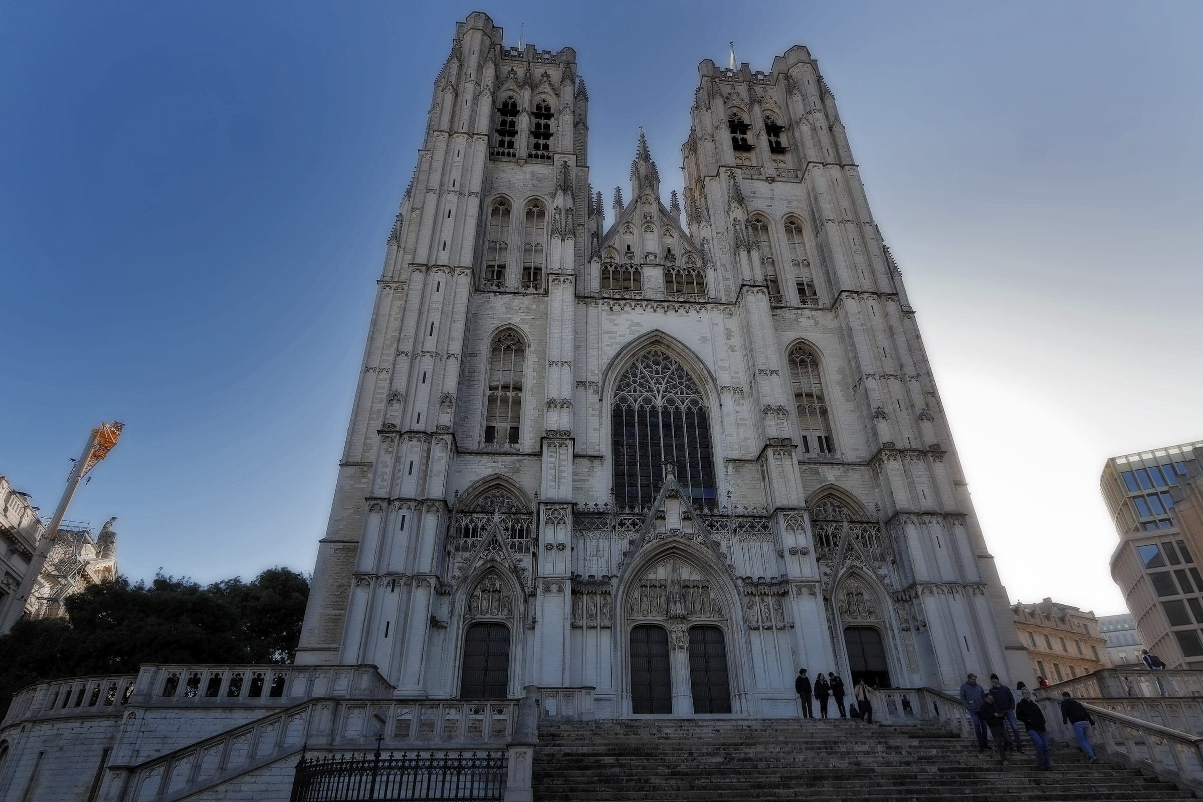 Steps climb to the twin-towered Gothic west front of the Cathedral of St. Michael and St. Gudula in Brussels.
